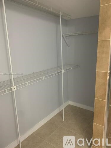 Empty white shelves in a room.