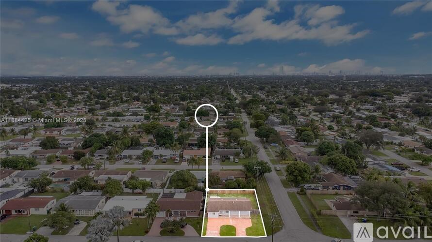 A bird's eye view of a residential area with a basketball court in the foreground.