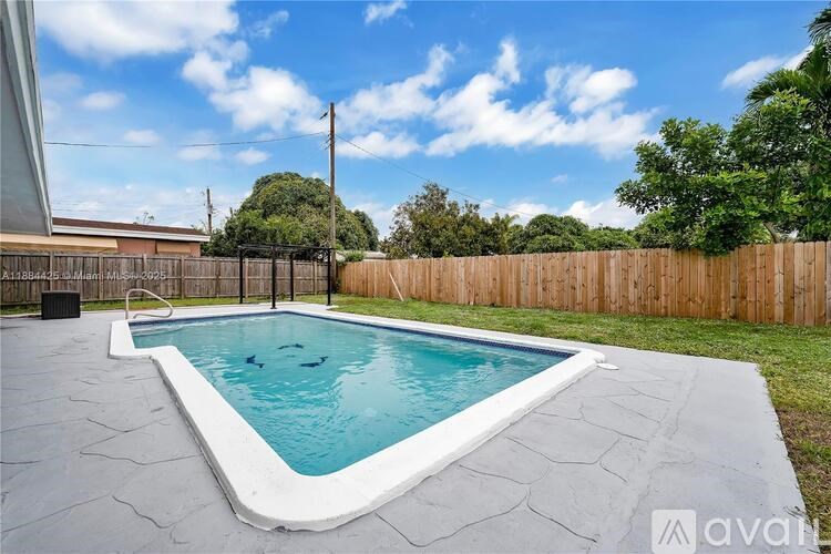 A small pool with a white border and blue water.