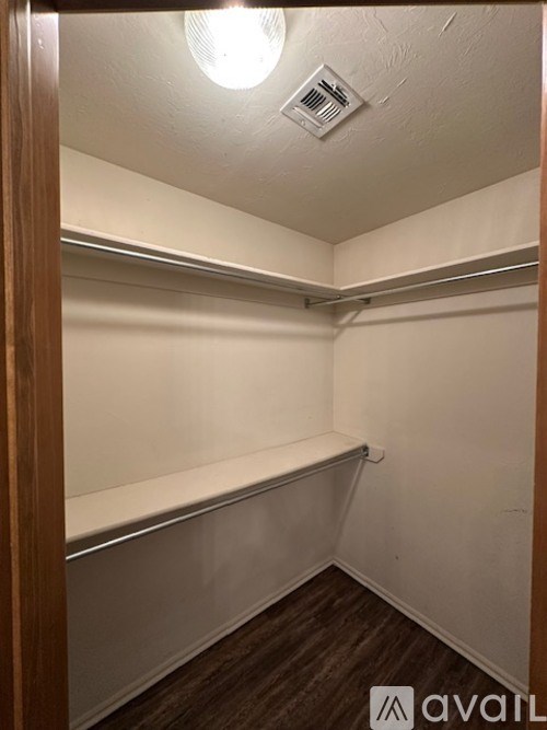 A small, empty room with a light on the ceiling.