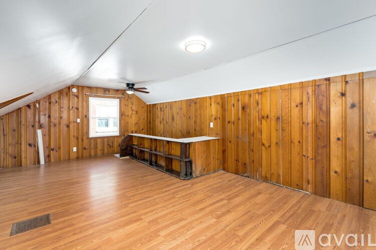 A room with wooden walls and a long table.