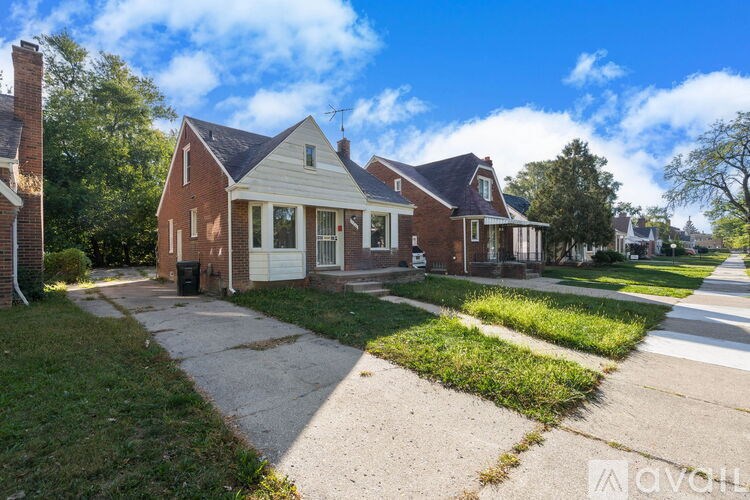 A house with a driveway in front of it.