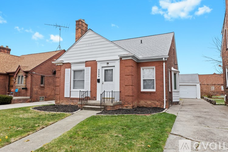 A house with a white front door and a brick facade.