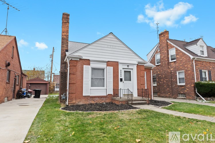 A house with a red brick exterior and a white front door.