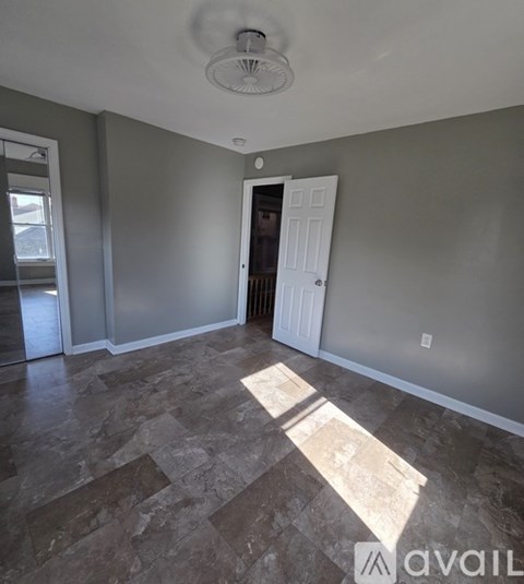 A room with a door and a window.