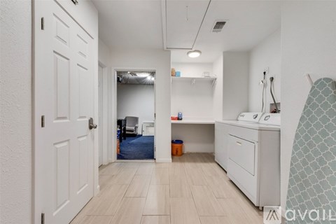 A white bathroom with a sink and a toilet.