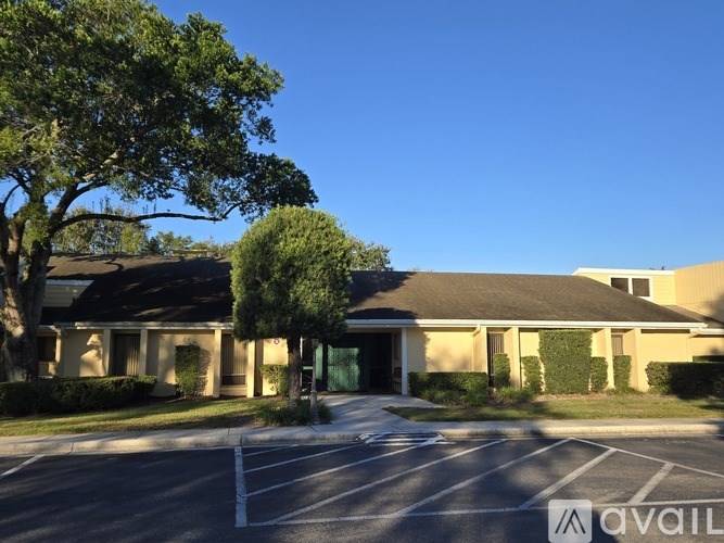 A building with a parking lot in front of it.