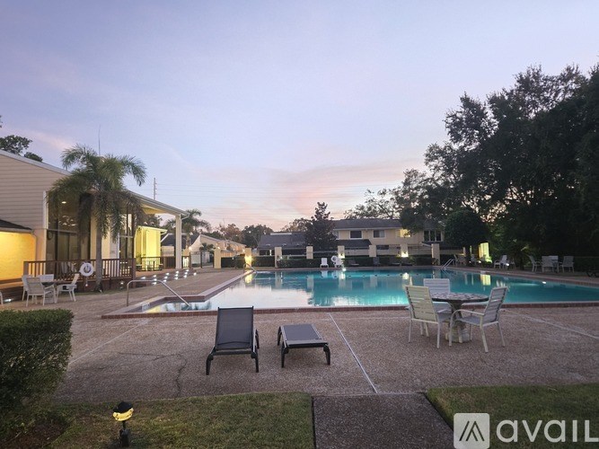 A pool area with chairs and a logo that says "AVAIL".
