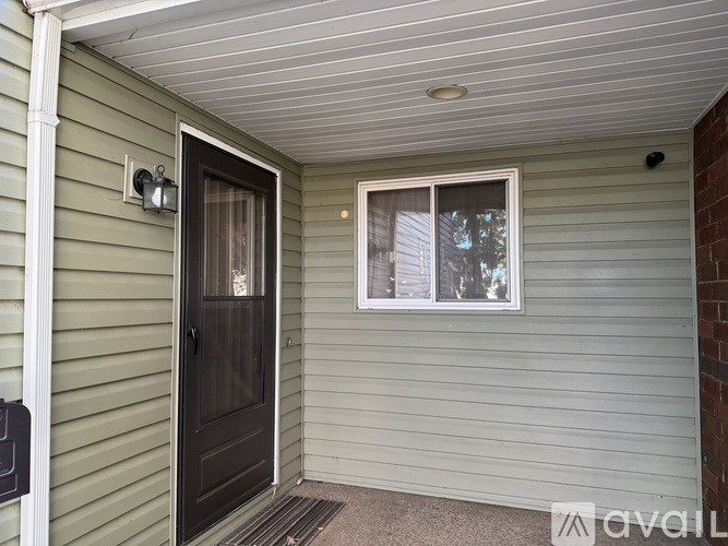 A small porch with a door and a window.