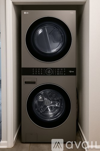 A front-loading washing machine with a digital control panel.