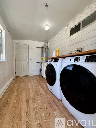 A laundry room with a washer and dryer.