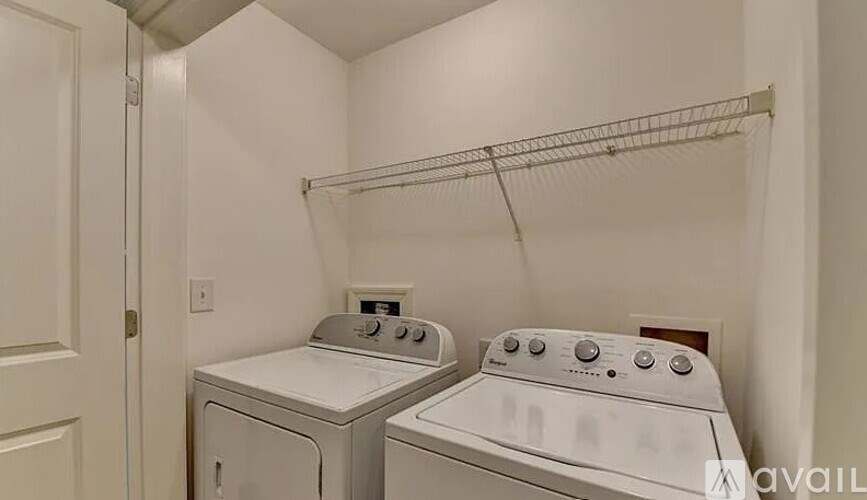 A laundry room with a washer and dryer.