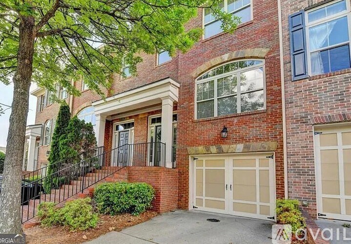 A red brick house with a white garage door.