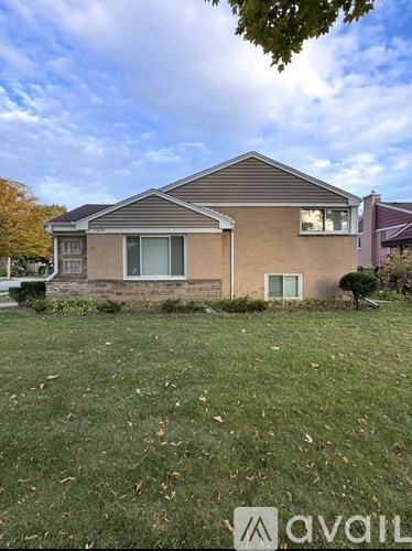 A house with a lawn in front of it is for sale.
