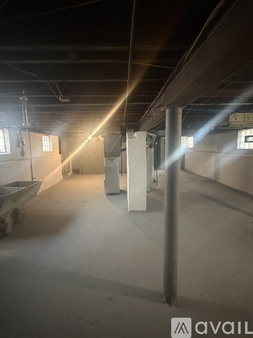 A large empty warehouse with beams and columns.