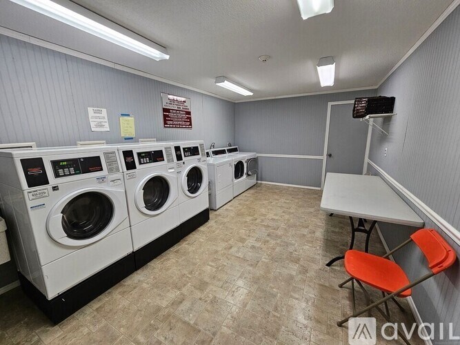 A row of washing machines in a laundromat.