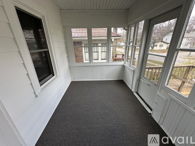 A sunny day in a room with a balcony.