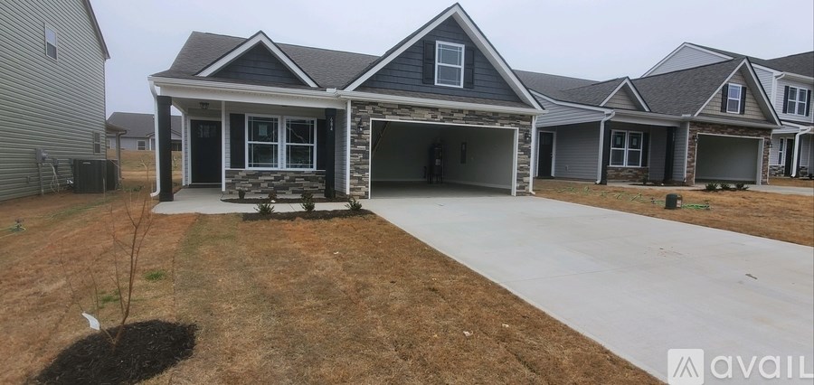 A house with a garage is available for sale.