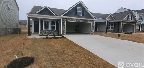 A house with a garage is available for sale.