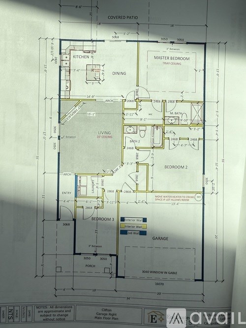 A floor plan for a house with a garage and three bedrooms.