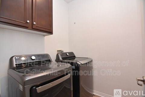 A stove and oven in a kitchen with cabinets above.