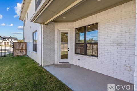 A white house with a glass door and a window.