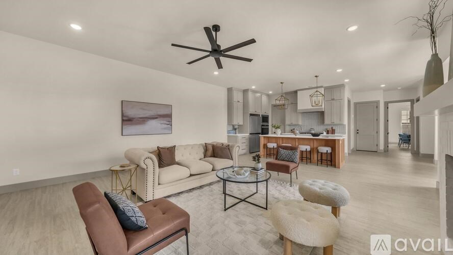 A living room with a brown leather chair and a coffee table.