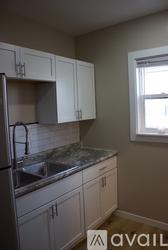 A kitchen with a sink and cabinets.