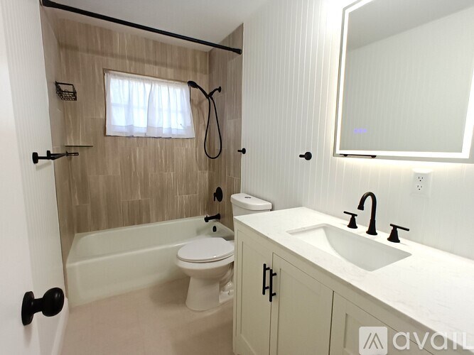 A bathroom with a white toilet and sink.