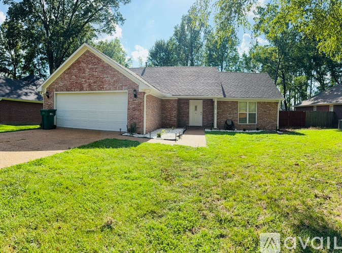 A house with a garage and a driveway.