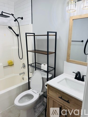 A bathroom with a toilet, sink, and shelves.