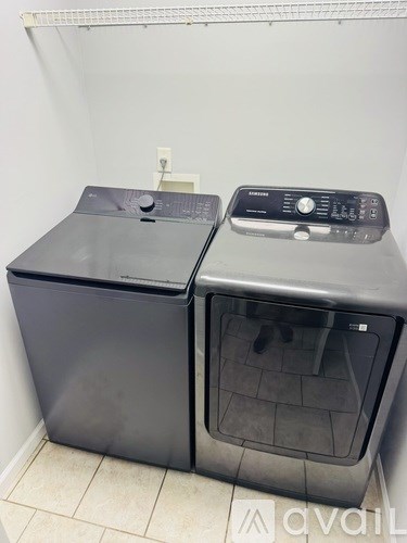 Two large black ovens with digital displays on top.