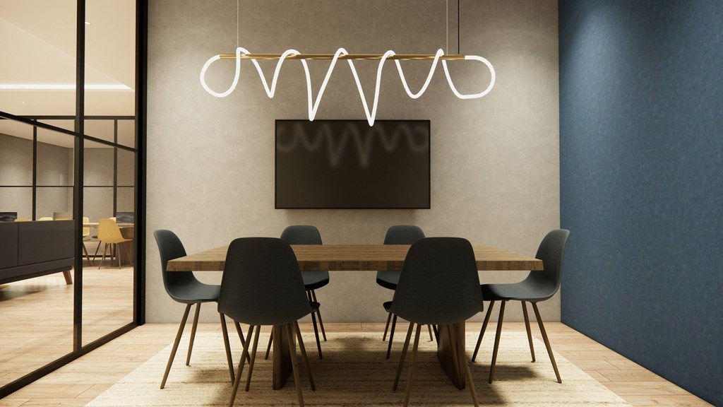 A modern dining room with a large table and chairs.