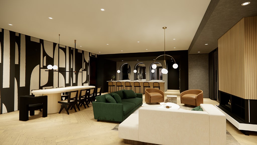 A modern living room with a white sofa and a black and white abstract painting on the wall.