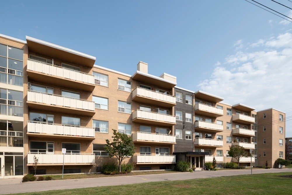 A large apartment complex with multiple balconies and windows.
