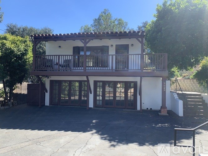 A house with a balcony and a patio.