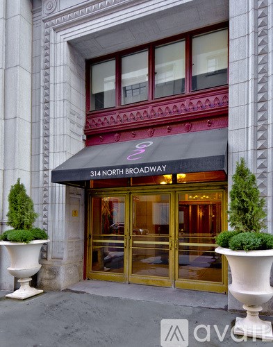 The front of a building with a sign that says 314 North Broadway.