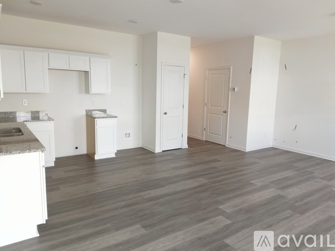 A kitchen area with a countertop and cabinets.