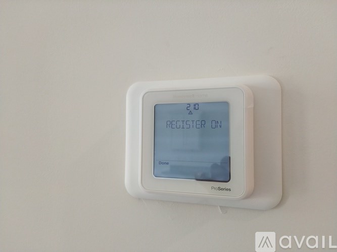 A white device with a blue screen that says "REGISTER ON".