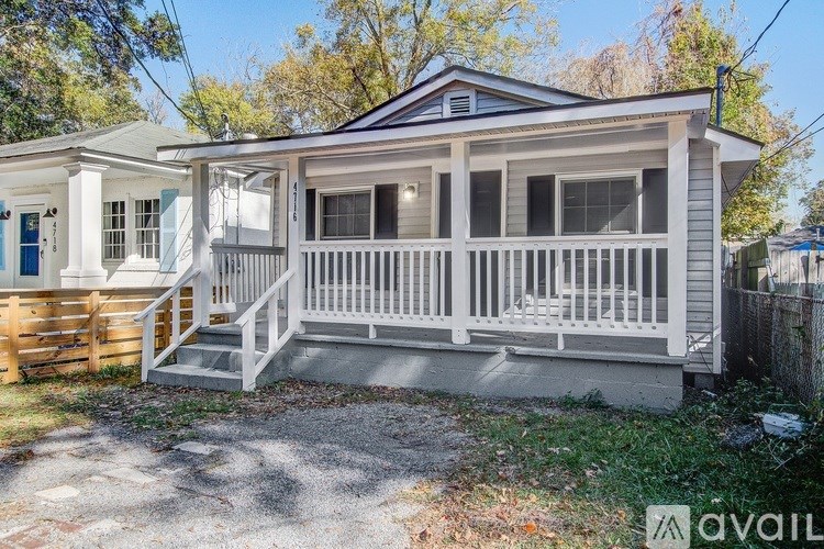A small house with a porch is available for rent.