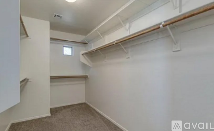 A room with white walls and a carpeted floor.