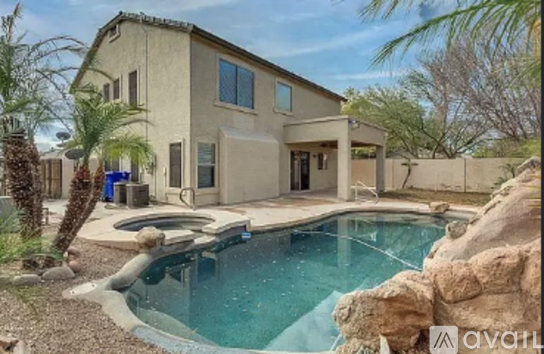 A house with a pool in the backyard.