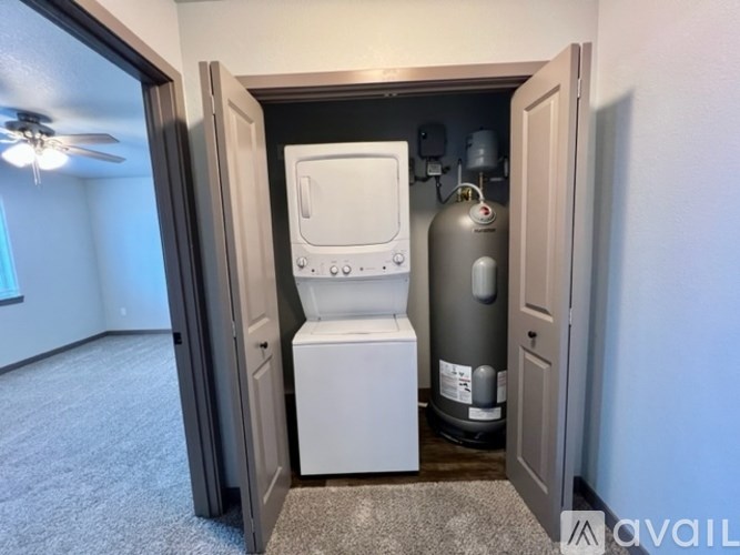 A room with a toilet and a tank in it.