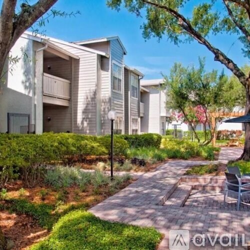 A sunny day at the apartment complex with a clear blue sky.