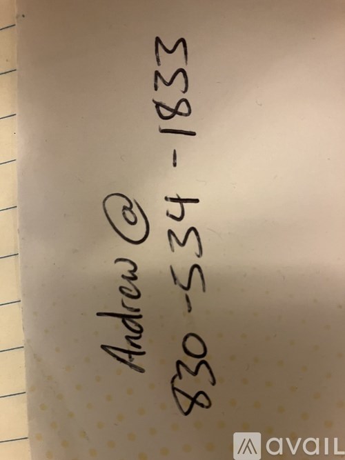 A white notebook with a handwritten address on it.