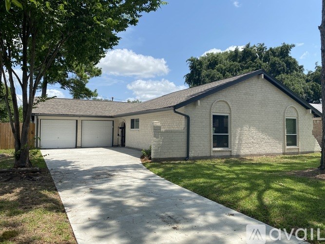 A house with a driveway and a garage.