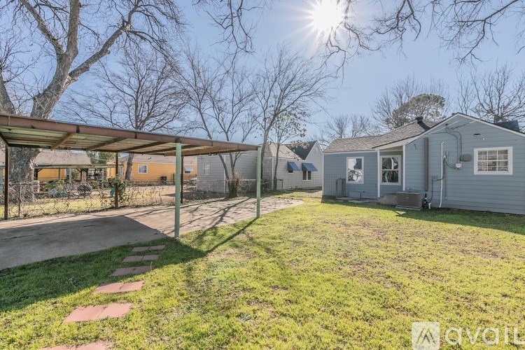 A sunny day at a residential area with houses and a covered walkway.