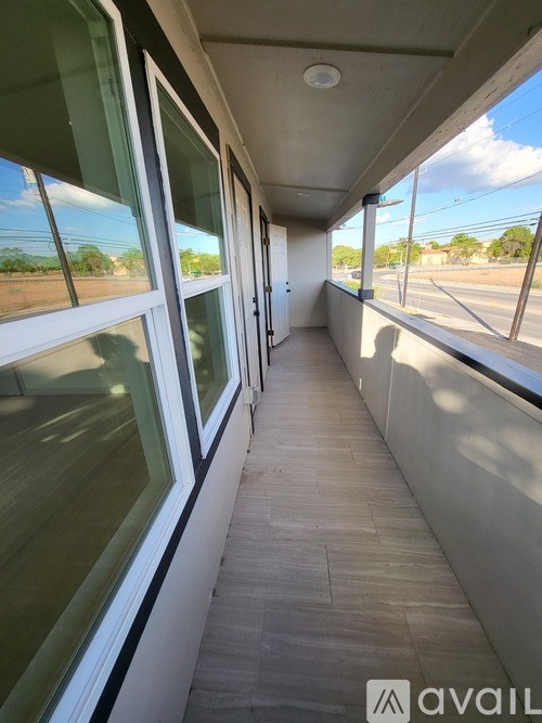 A long hallway with windows on both sides.