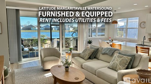 A living room with a couch, chairs, and a coffee table is shown.