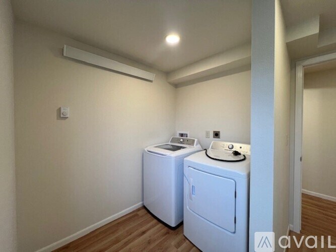 A laundry room with a washer and dryer.